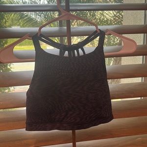 This beautiful Lululemon sports bra in a dark black ish color good for the gym.